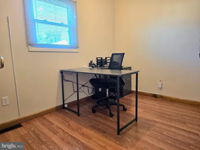 a workspace with wooden floor