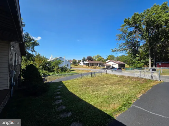 a view of a swimming pool with an outdoor space and seating area