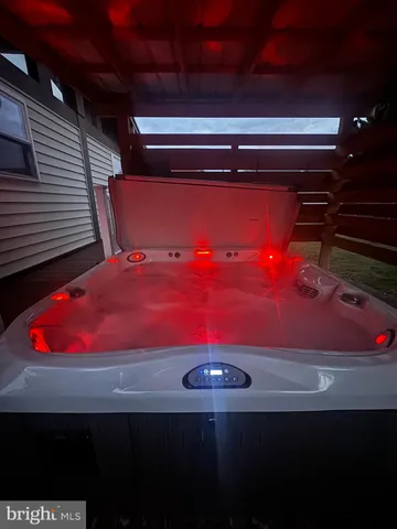 a view of a backyard with wooden fence