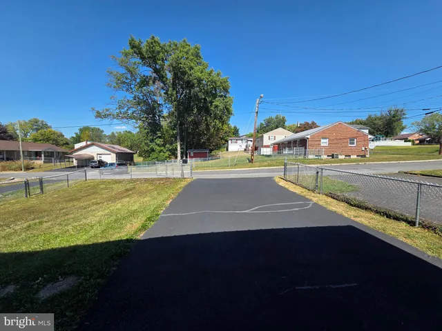 a view of a swimming pool with an outdoor space and seating area