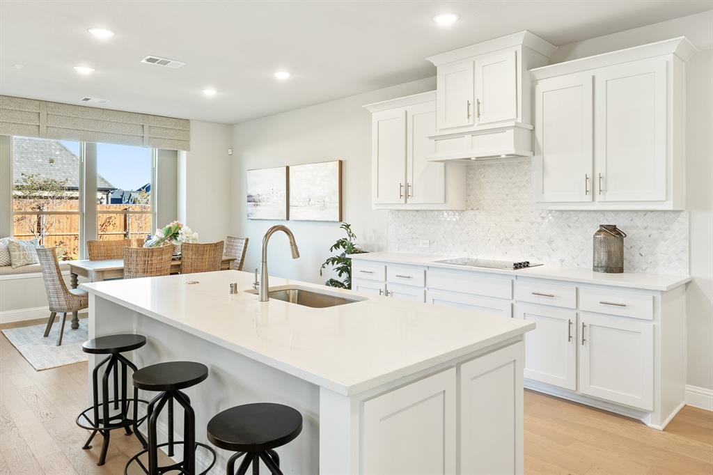 817 Rusty Run Drive Midlothian, TX 76065 - Photo 15 of 40 a kitchen with stainless steel appliances a table and chairs in it