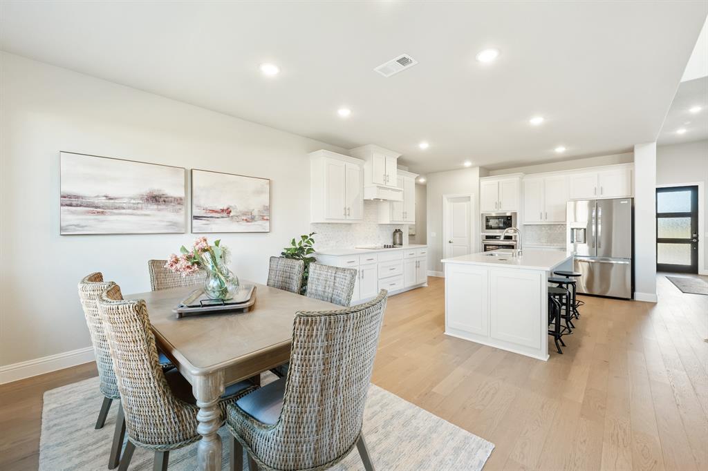 817 Rusty Run Drive Midlothian, TX 76065 - Photo 19 of 40 a view of kitchen with refrigerator and wooden floor