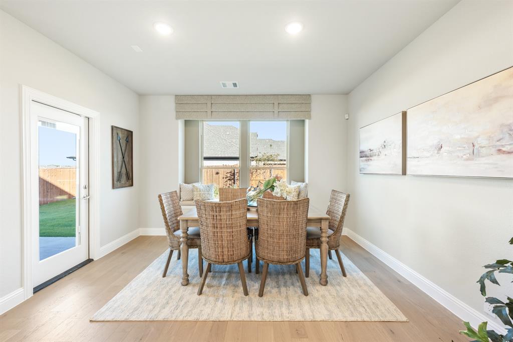 817 Rusty Run Drive Midlothian, TX 76065 - Photo 21 of 40 a view of a dining room with furniture window and wooden floor