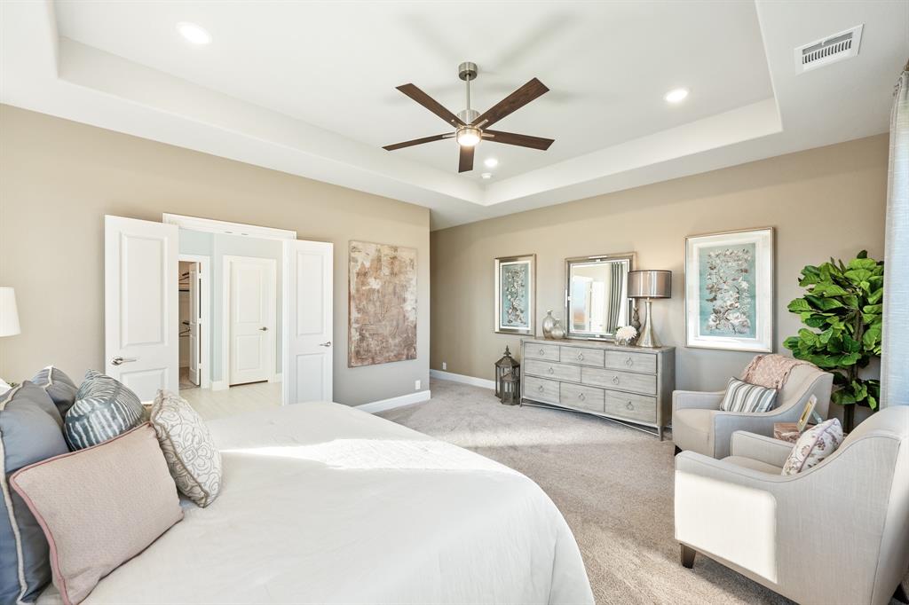 817 Rusty Run Drive Midlothian, TX 76065 - Photo 23 of 40 a spacious bedroom with a large bed and ceiling fan