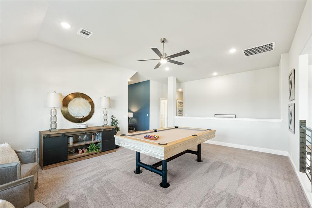 817 Rusty Run Drive Midlothian, TX 76065 - Photo 29 of 40 a living room with table a rug and a ceiling fan