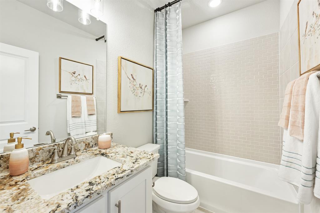 817 Rusty Run Drive Midlothian, TX 76065 - Photo 33 of 40 a bathroom with a granite countertop sink toilet and shower