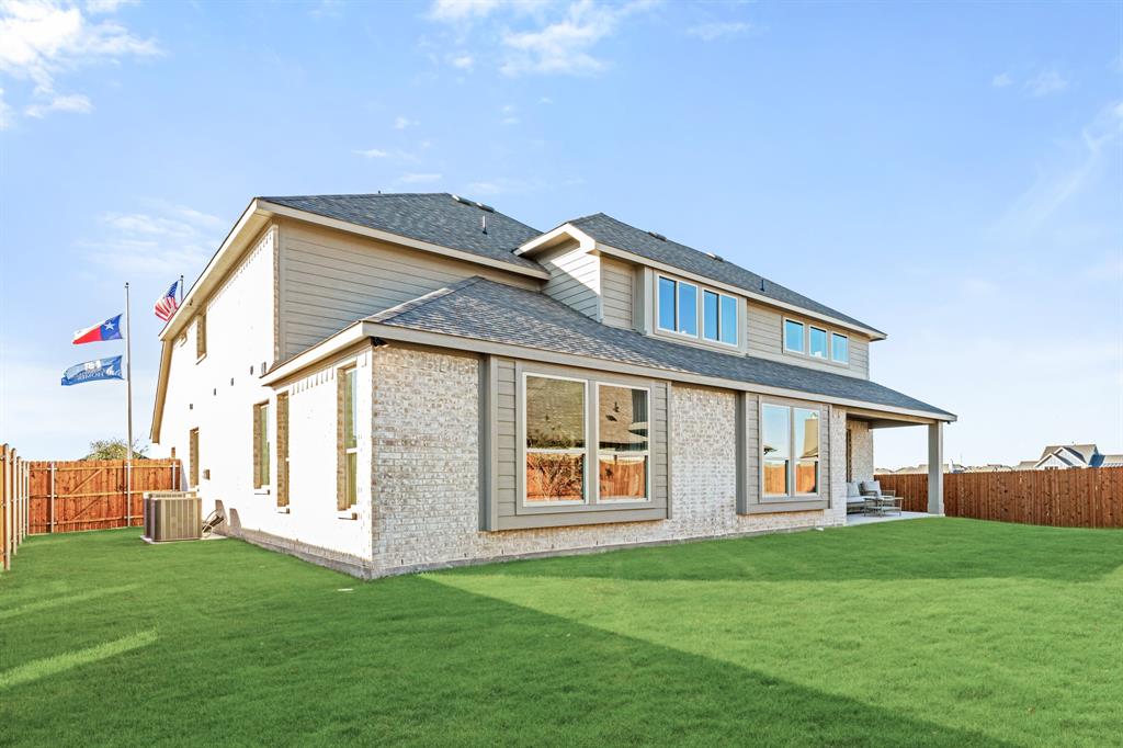 817 Rusty Run Drive Midlothian, TX 76065 - Photo 39 of 40 a front view of a house with a garden