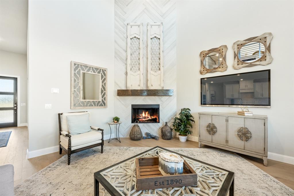 817 Rusty Run Drive Midlothian, TX 76065 - Photo 8 of 40 a living room with furniture and a fireplace