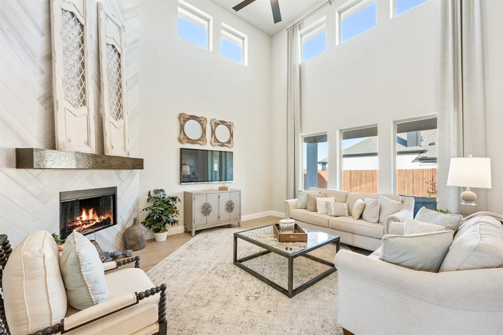 817 Rusty Run Drive Midlothian, TX 76065 - Photo 9 of 40 a living room with furniture and a fireplace