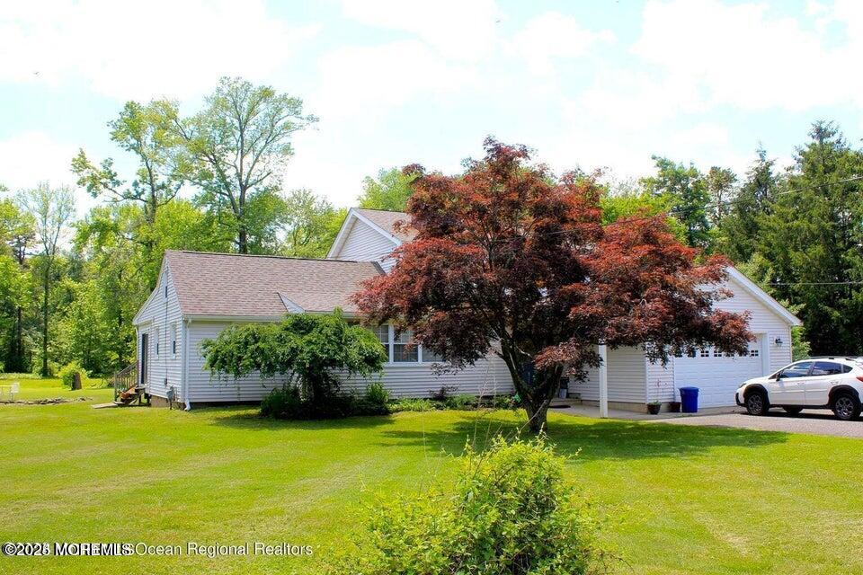 150 Easy Street Howell, NJ 07731 - Photo 2 of 23 a front view of a house with garden