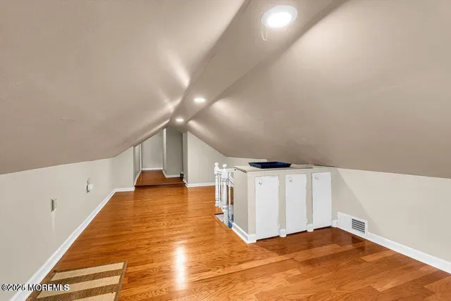 a view of an empty room with stairs