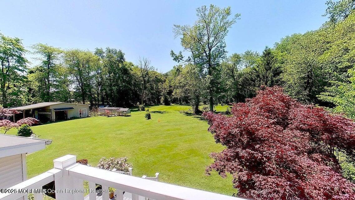 150 Easy Street Howell, NJ 07731 - Photo 3 of 23 a view of a swimming pool with a patio
