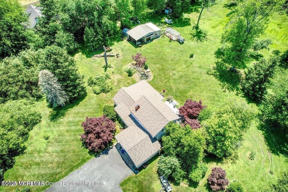 150 Easy Street Howell, NJ 07731 - Photo 5 of 23 an aerial view of a house with a yard and garden