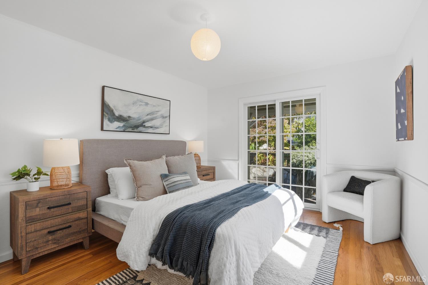 4614 Jacobus Avenue Oakland, CA 94618 - Photo 22 of 40 a bedroom with a bed and wooden floor