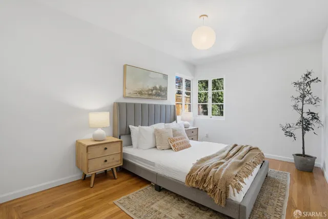 a bedroom with furniture and a window
