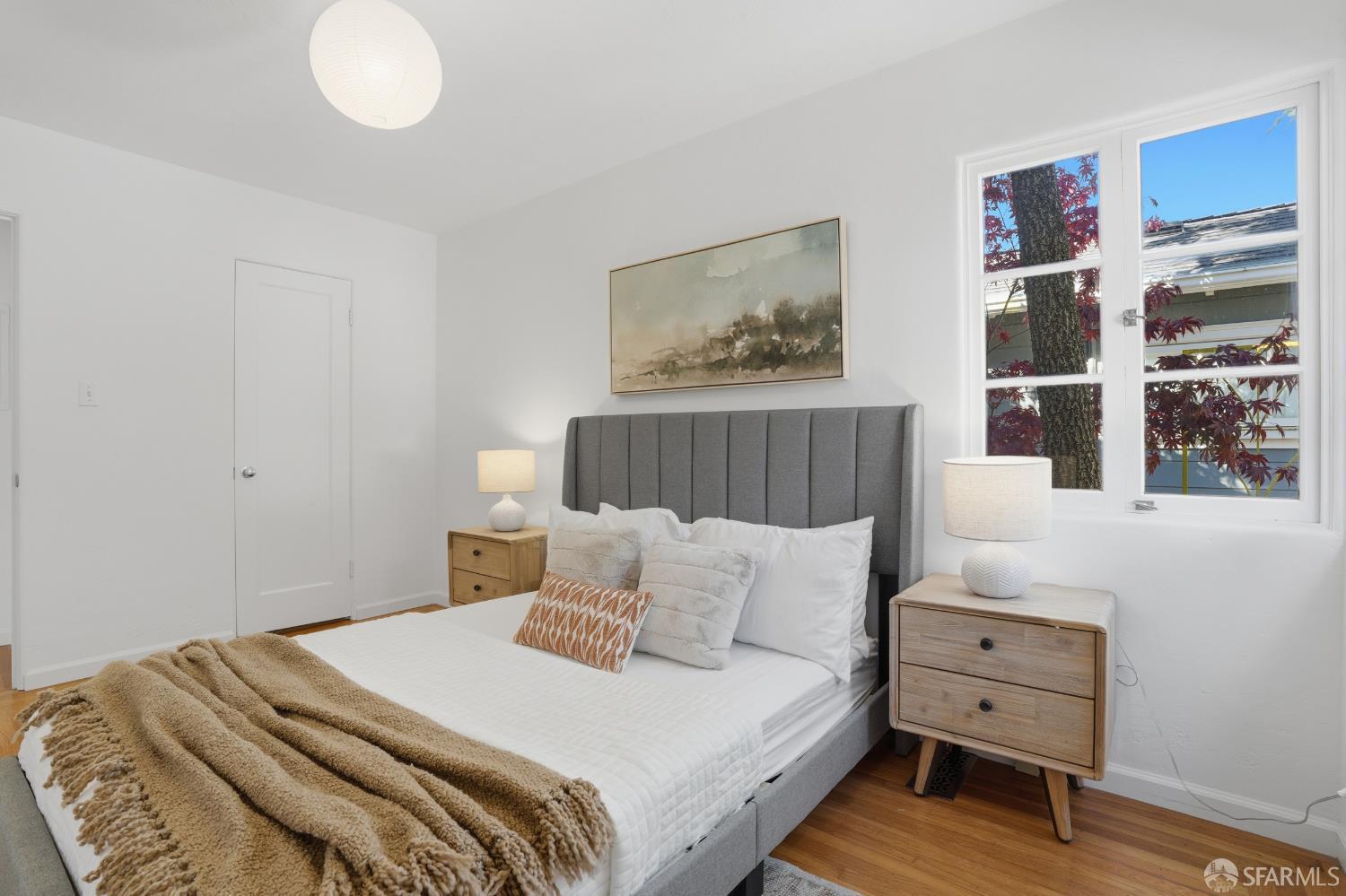 4614 Jacobus Avenue Oakland, CA 94618 - Photo 24 of 40 a bedroom with a bed and a painting on the wall