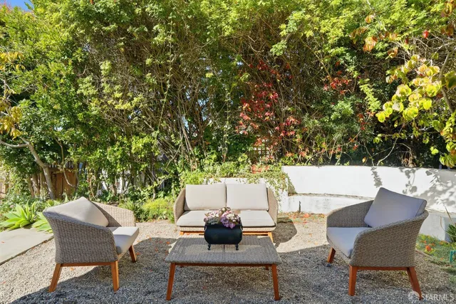 a view of a table and chairs in the patio