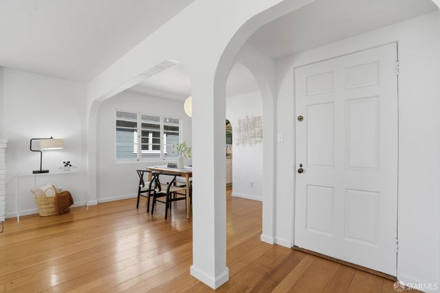 a view of a livingroom with furniture and wooden floor