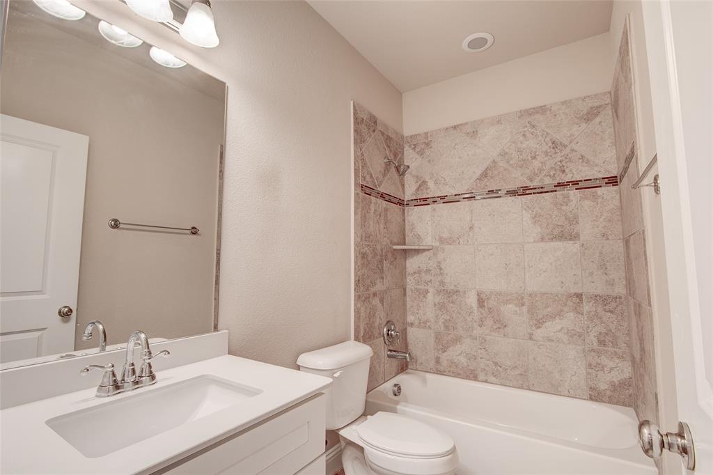 6156 Rilla Street Frisco, TX 75035 - Photo 13 of 32 a bathroom with a sink toilet and shower