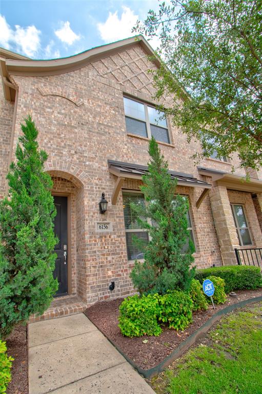 6156 Rilla Street Frisco, TX 75035 - Photo 27 of 32 front view of a house with potted plants