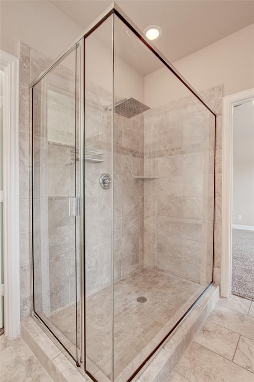 6156 Rilla Street Frisco, TX 75035 - Photo 29 of 32 a bathroom with a glass shower door