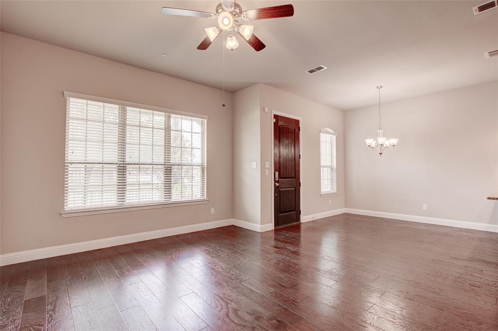 6156 Rilla Street Frisco, TX 75035 - Photo 31 of 32 a view of an empty room with a window and wooden floor