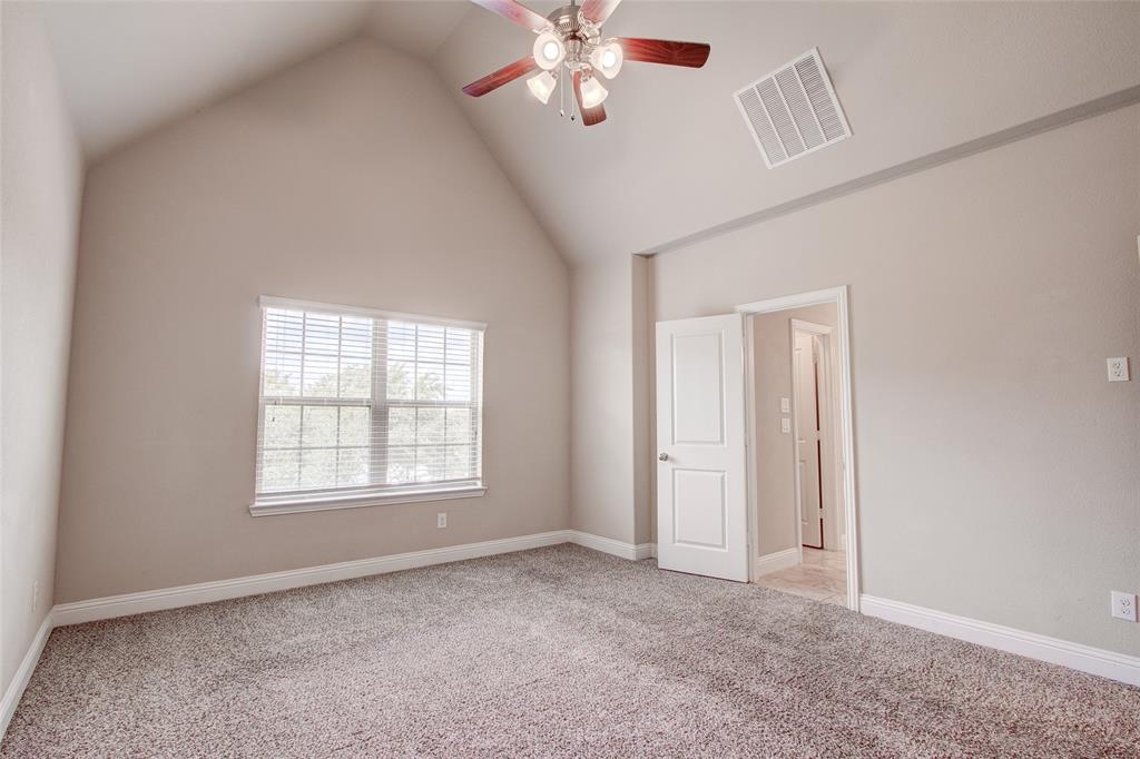 6156 Rilla Street Frisco, TX 75035 - Photo 4 of 32 an empty room with windows and fan