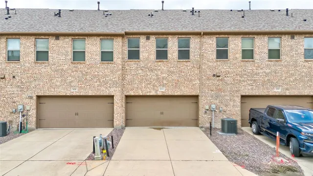 a front view of a house with parking space