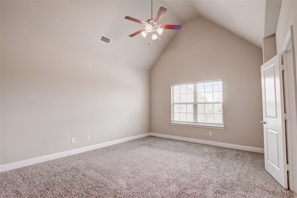 6156 Rilla Street Frisco, TX 75035 - Photo 6 of 32 an empty room with a window and a fan