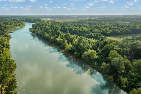 a view of lake with green space