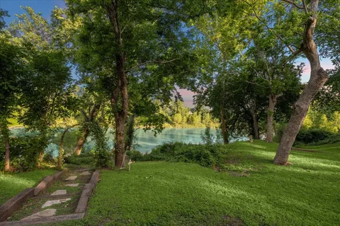 swimming pool view with a seating space