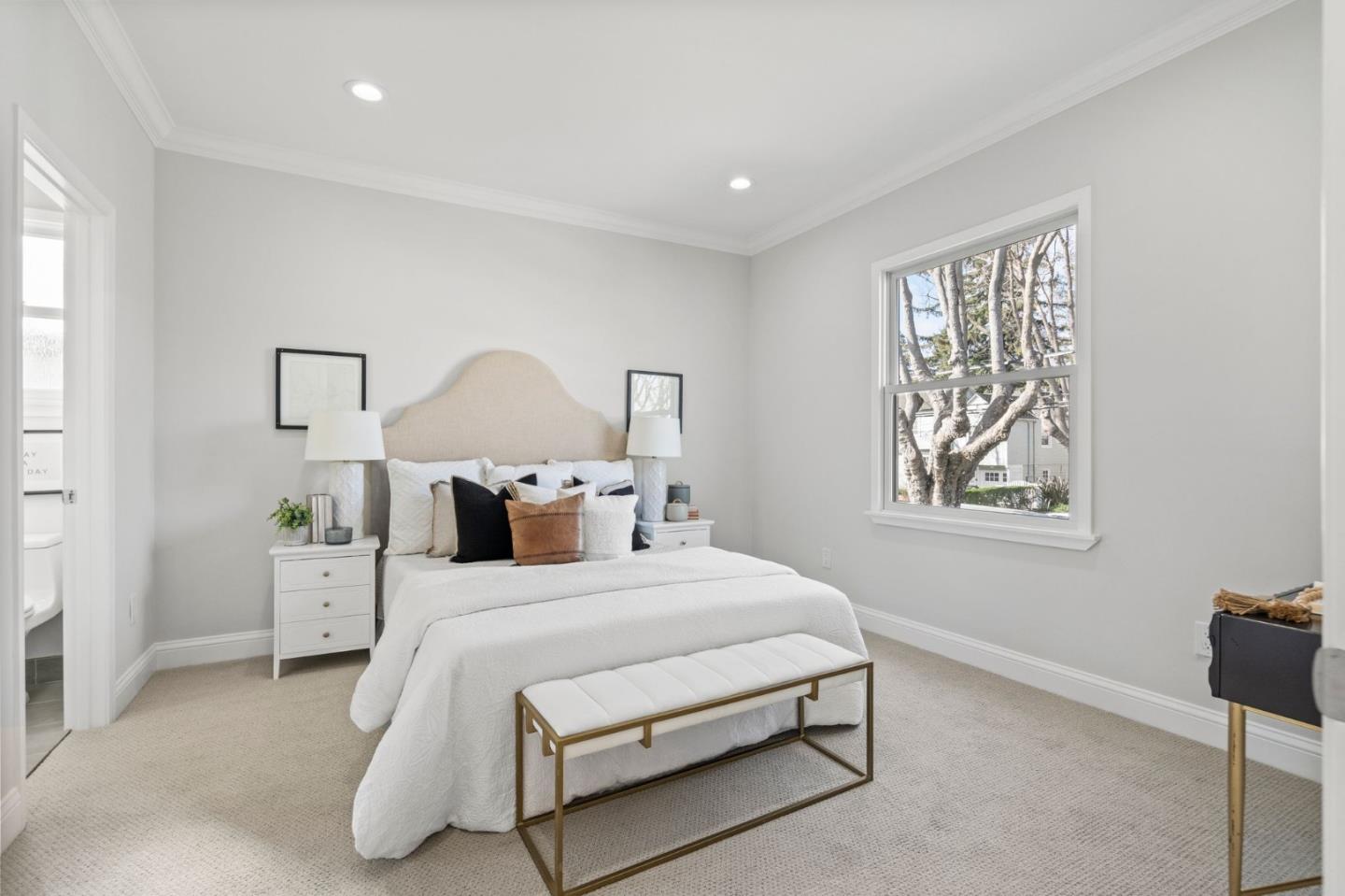 511 Corbitt Drive Burlingame, CA 94010 - Photo 17 of 43 a bedroom with a bed and a lamp