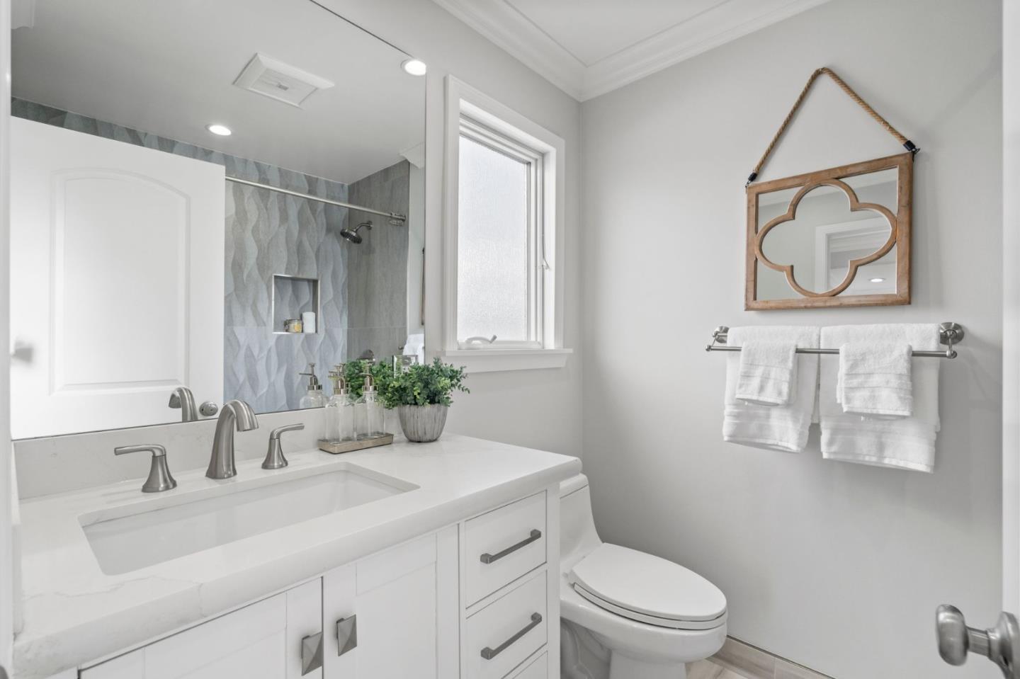 511 Corbitt Drive Burlingame, CA 94010 - Photo 30 of 43 a bathroom with a sink vanity mirror and toilet
