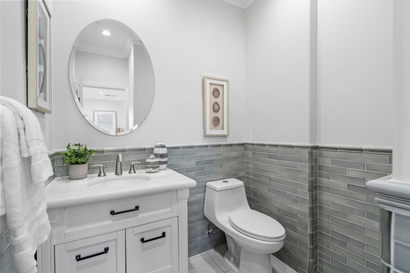 511 Corbitt Drive Burlingame, CA 94010 - Photo 31 of 43 a bathroom with a toilet sink and mirror