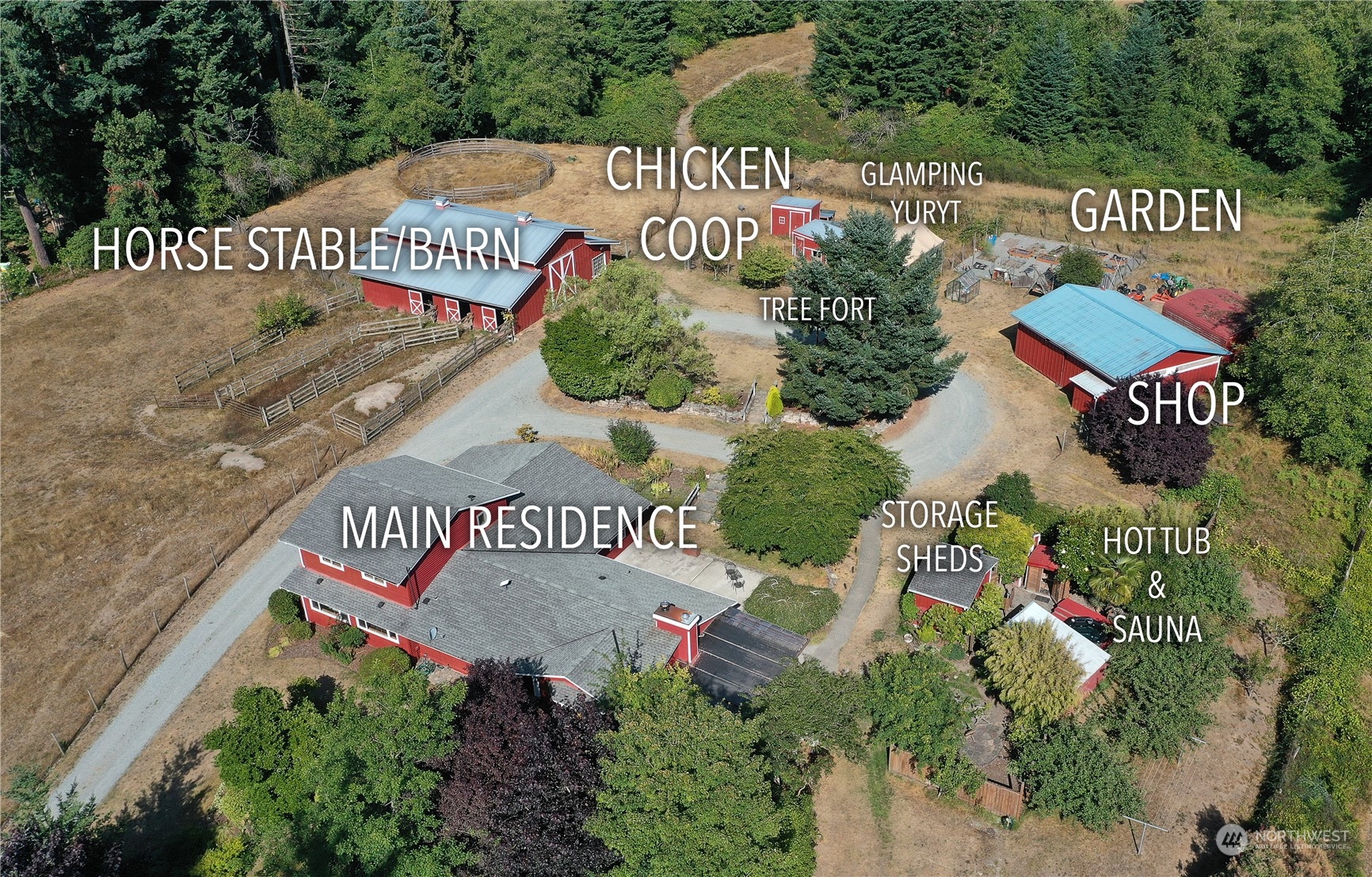 5493 Langley Road Langley, WA 98260 - Photo 1 of 36 an outdoor space with signage and flags