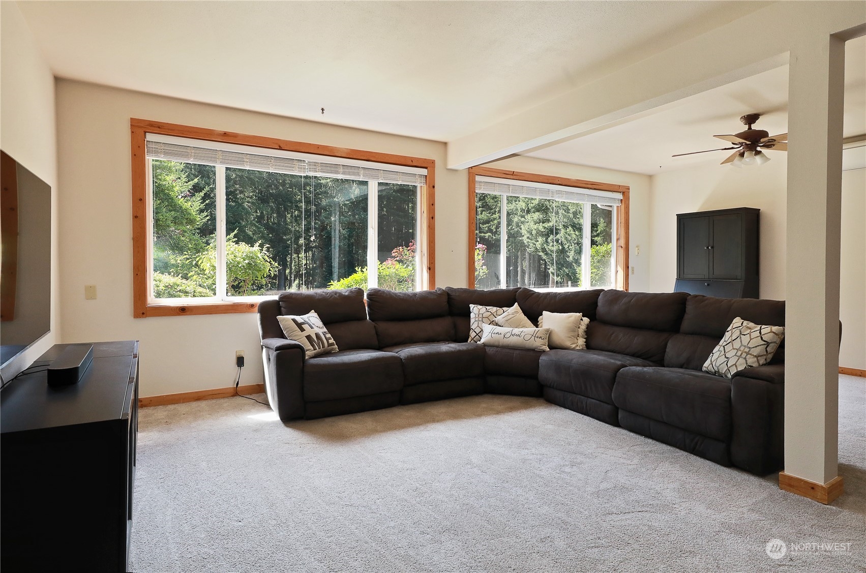 5493 Langley Road Langley, WA 98260 - Photo 11 of 36 a living room with furniture and a flat screen tv