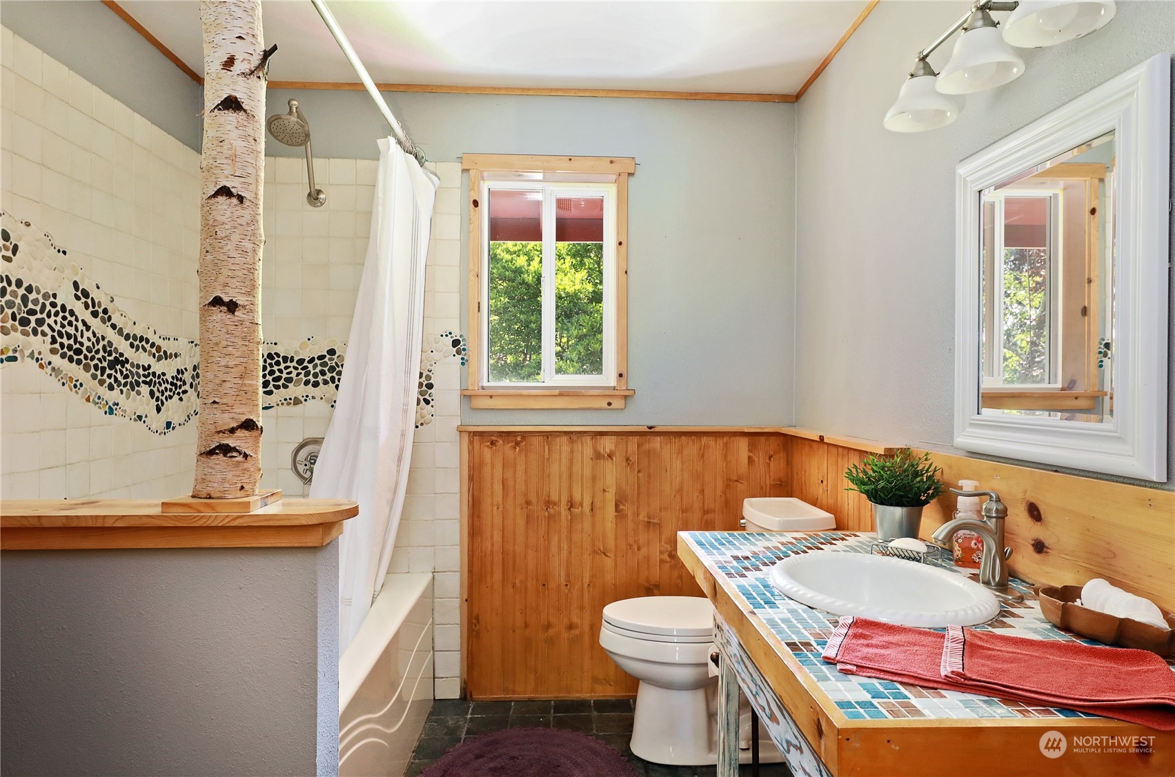5493 Langley Road Langley, WA 98260 - Photo 16 of 36 a bathroom with a sink toilet and shower