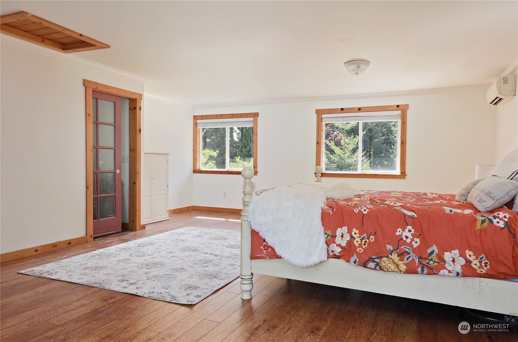 5493 Langley Road Langley, WA 98260 - Photo 18 of 36 a bed room with a bed and painting on the wall