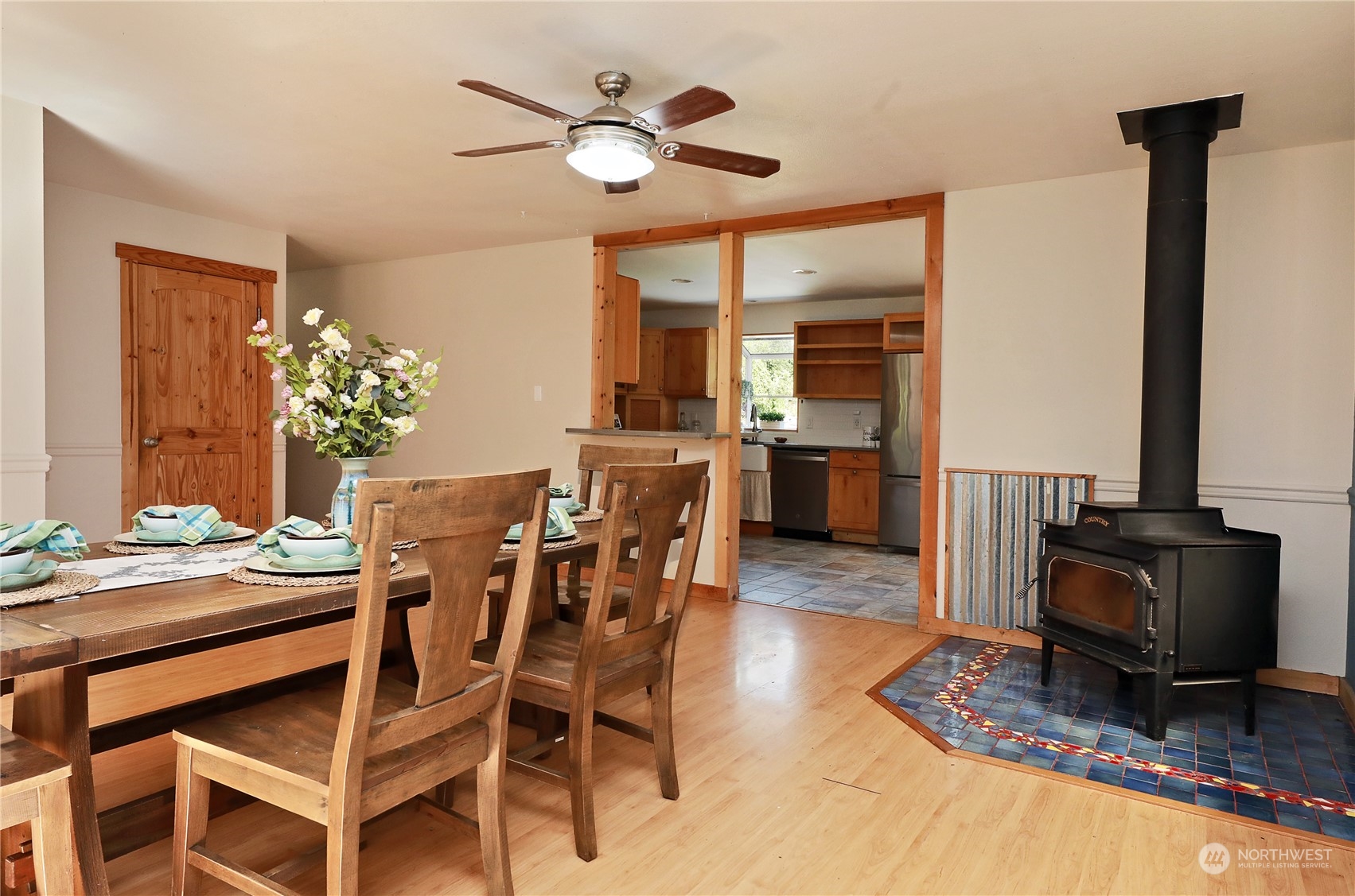 5493 Langley Road Langley, WA 98260 - Photo 7 of 36 a view of a dining room with furniture and chandelier