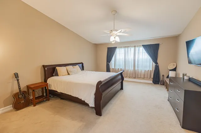 a spacious bathroom with a shower sink and mirror