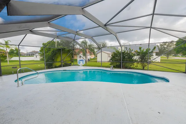 a view of a swimming pool with a patio