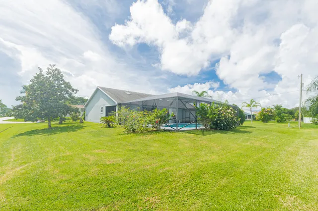 a house with swimming pool in front of it
