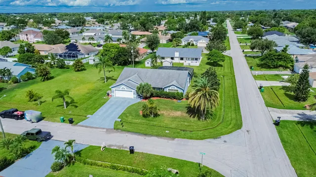 an aerial view of residential houses with outdoor space