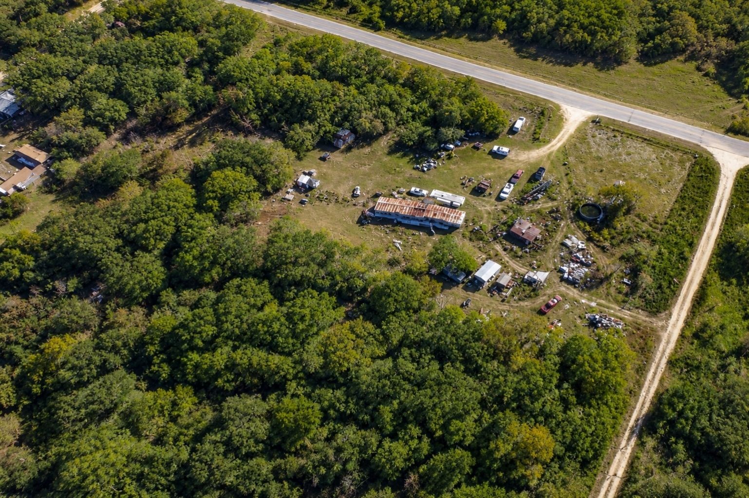9880 Dix Road Kingsbury, TX 78638 - Photo 36 of 39 Aerial property view showing road frontage, wooded areas, and surrounding land, enhanced from Google Earth imagery.