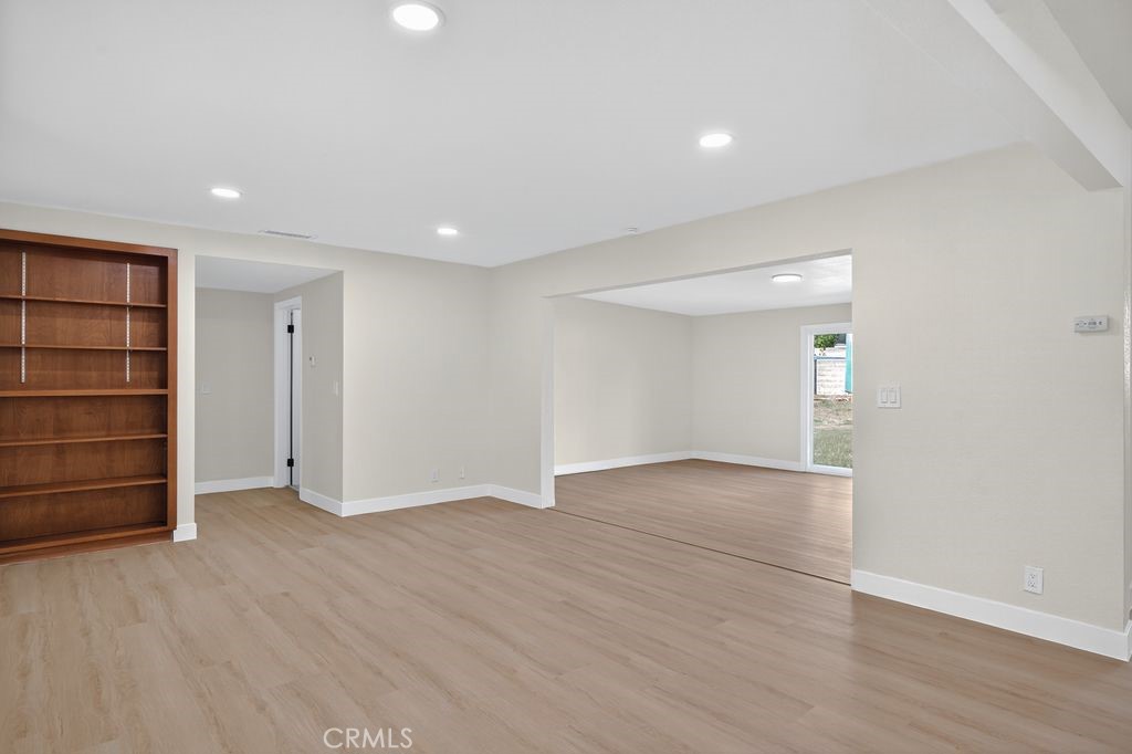 606 East Jackson Street Rialto, CA 92376 - Photo 13 of 29 a view of an empty room with wooden floor and closet