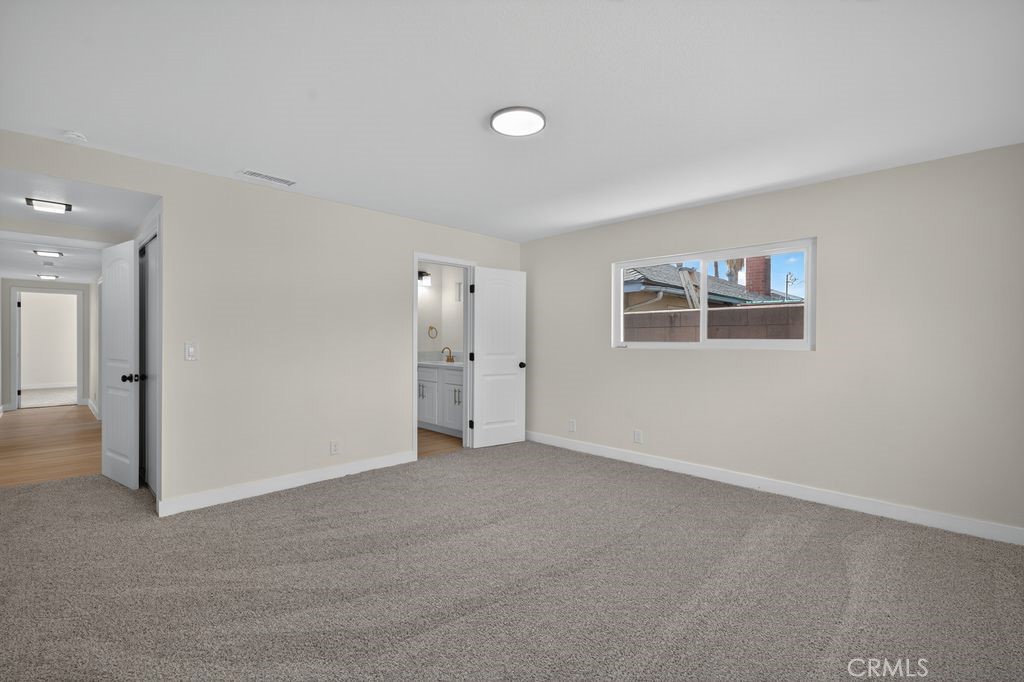 606 East Jackson Street Rialto, CA 92376 - Photo 15 of 29 a view of an empty room with closet and a bathroom