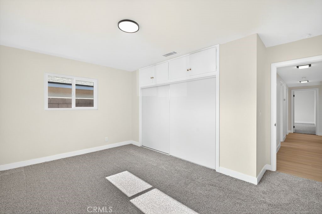 606 East Jackson Street Rialto, CA 92376 - Photo 20 of 29 an empty room with windows