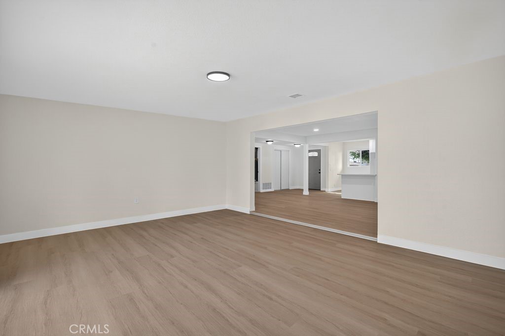 606 East Jackson Street Rialto, CA 92376 - Photo 25 of 29 a view of empty room with wooden floor