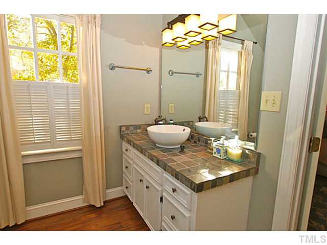 3217 Anderson Drive Raleigh, NC 27609 - Photo 15 of 25 Master bathroom with slate tile countertops, new light fixtures and a new window. Master Bath/Spa