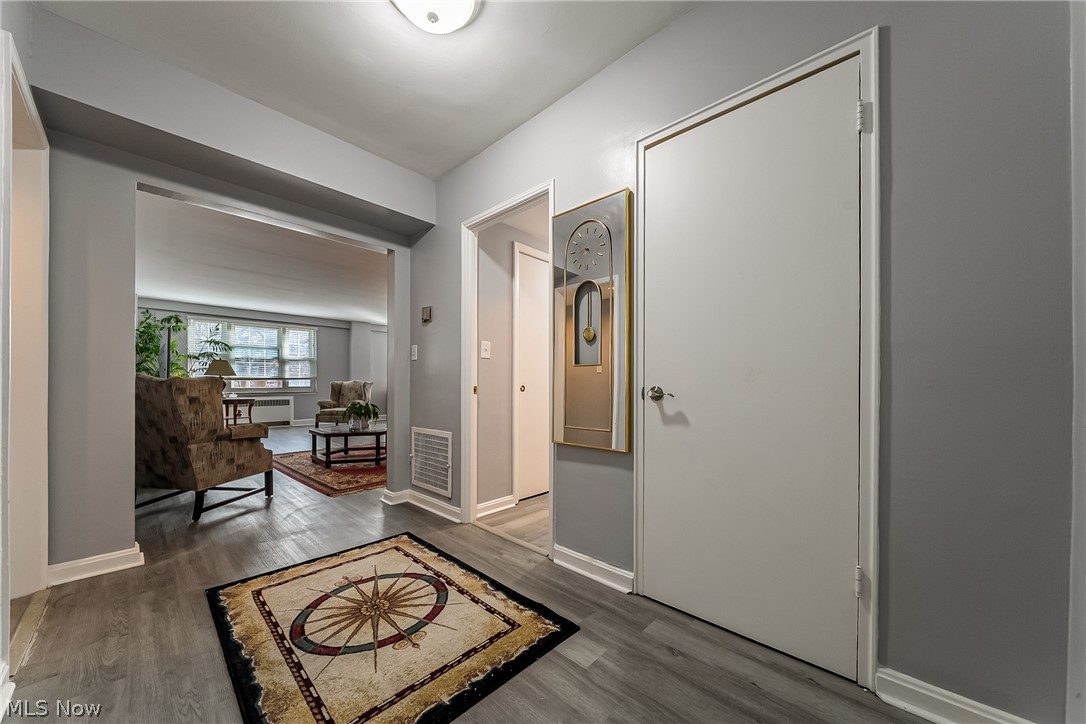 13800 Fairhill Road, Unit 306 Cleveland, OH 44120 - Photo 43 of 48 Hallway featuring wood finished floors and baseboards